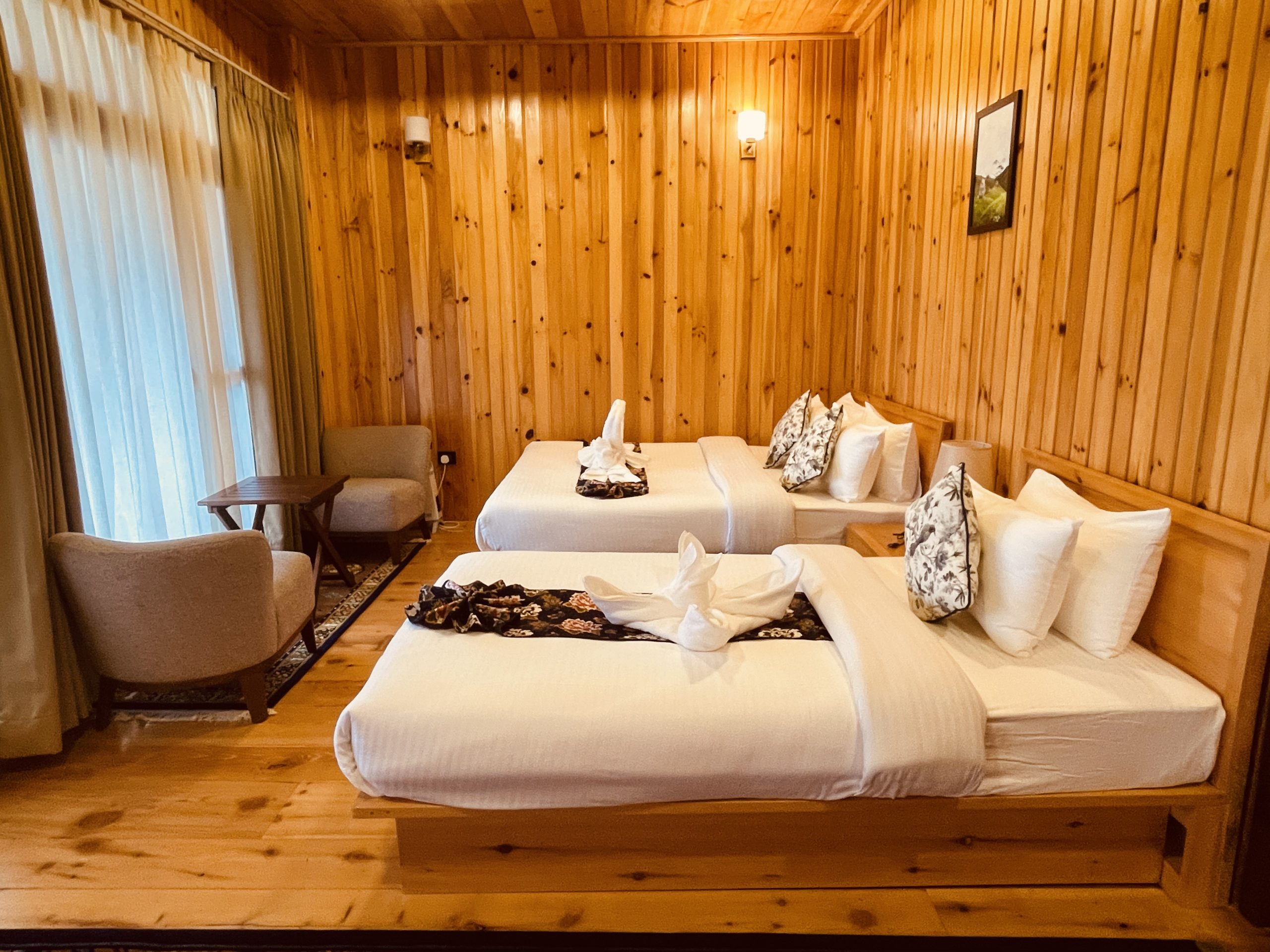 Family Suite with a queen bed, a single bed and a seating corner